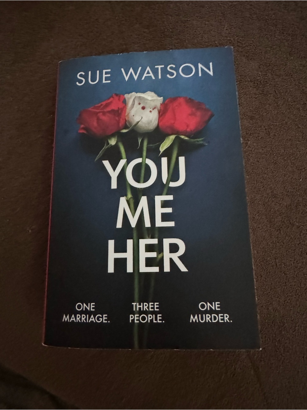 Sue Watson "You Me Her" Paperback Book - Dark Blue Cover with Red & White Roses